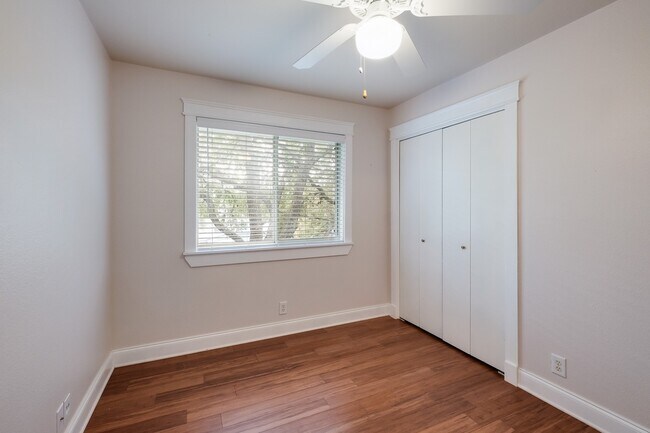 Building Photo - Modern Elegance: 3-Bedroom Townhome with Wood Flooring, Shaded Deck, and Inclusive Amenities