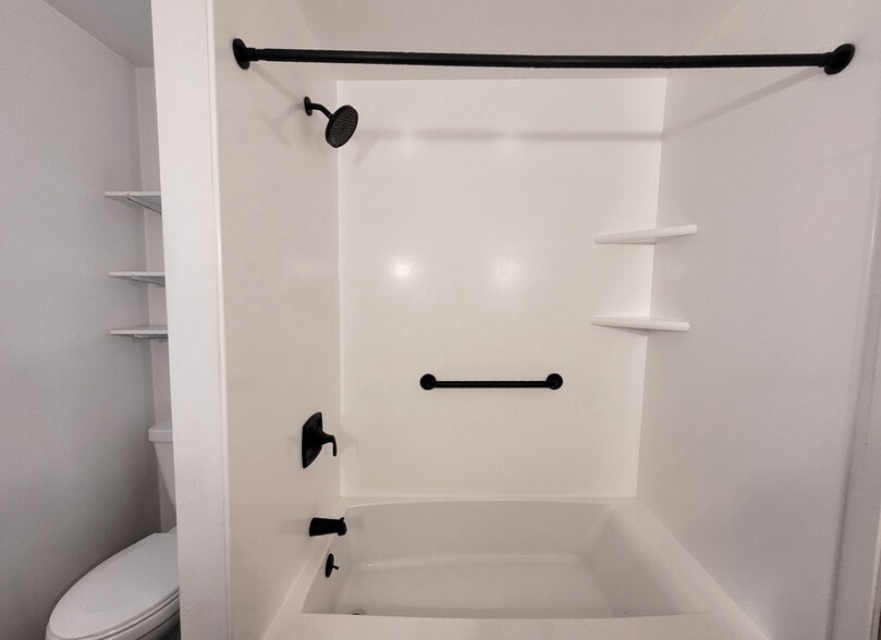 Bathroom showing shower and bath - 649 N Hayes St