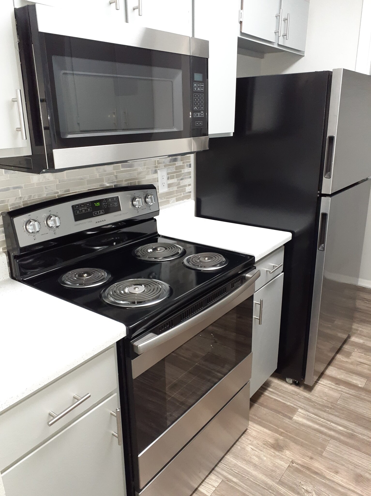 Stainless & Black Appliance Package in all Kitchens - City Pines Apartment Homes
