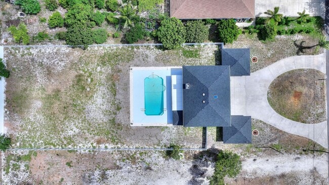 Building Photo - Rare Luxury Lease Opportunity | Spectacular 5-Bedroom Pool Estate on Nearly ¾ Acre Near Gulf Beaches