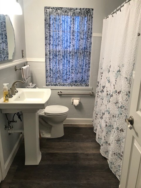 Bathroom with grab bar by toilet and in shower - 11310 Manchester Rd