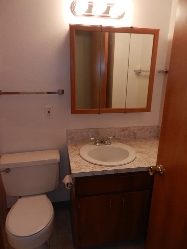 Building Photo - Well-Located Home with Fireplace, Fenced Yard & 2-Car Garage