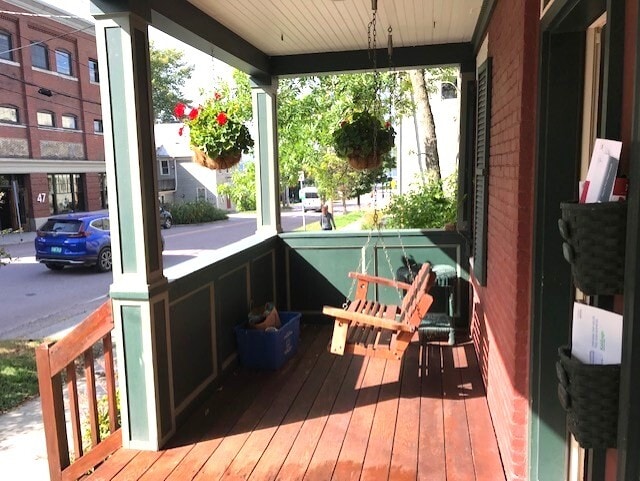 Hanging swing on front porch - 58 Maple St
