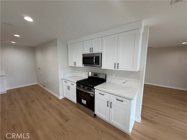 Building Photo - 6934 Woodlake Ave
