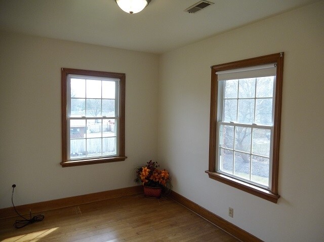 East bedroom window view. Two vinyl windows and central enclosed globe lighting. - 742 E Ford Ave