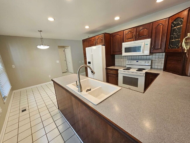 Building Photo - Private 4 Bedroom Home on 0.75 Acres with Great Room Fireplace, Wet Bar & 3-Season Room, 2 Car At...