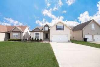 Building Photo - Pet Friendly Three Bedroom with Bonus!