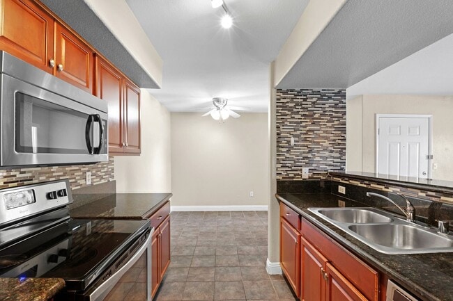 Building Photo - SE!!! Gated!! 1 Bedroom 1st Floor!! One Car Garage!!! Community Pool, Spa, Clubhouse!!! All tile ...