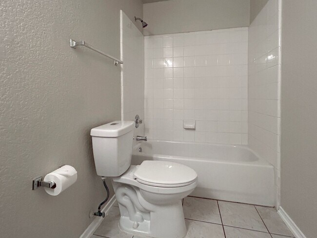 Building Photo - Northeast 3/2 with New Bedroom Floors & Covered Patio