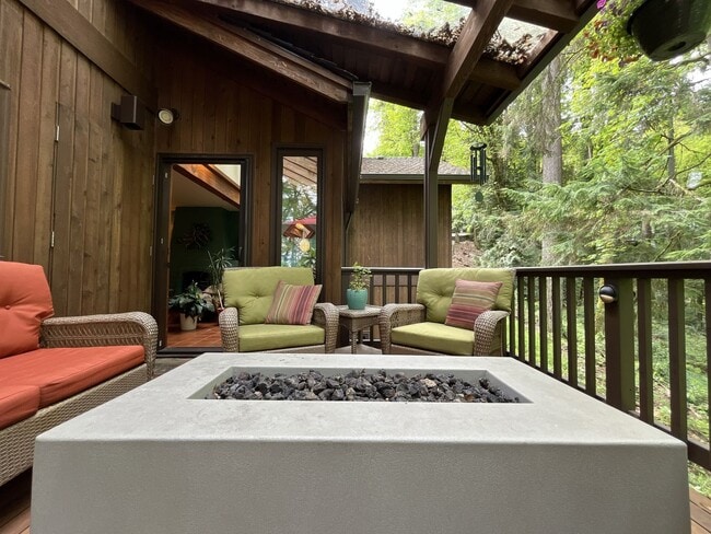 Building Photo - One-of-a-Kind Custom Home with Wall of Windows, Stone Fireplaces, Expansive Entertainment Space &...