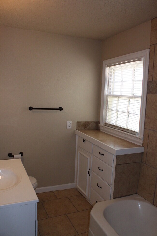 Building Photo - PRE -LEASING FOR AUGUST ! Spacious 4 Bedroom/2 Bath House