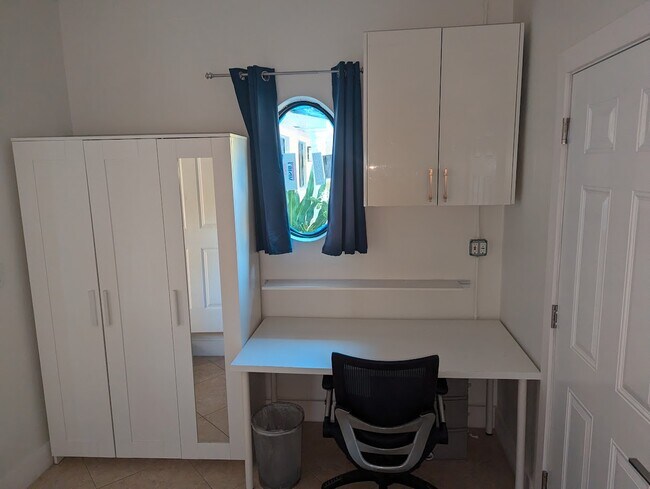 Large Armoire, desk - 9501 SW 69th Ct