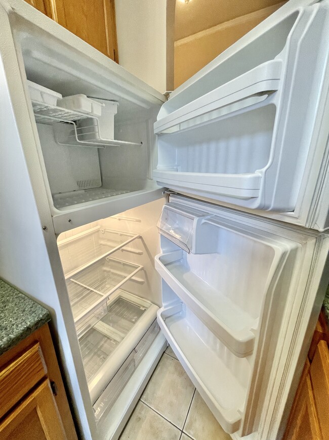 Clean refrigerator ready to go - 210 Martine Ave