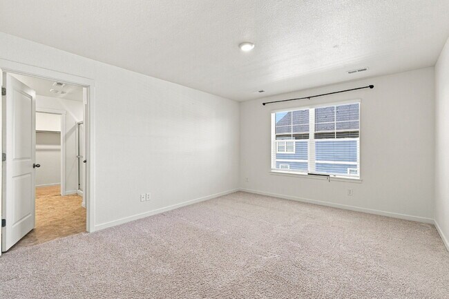 Building Photo - Spacious 4 Bedroom, 2.5 Baths in Bennett! 3 Car Attached Garage. Corner Lot!