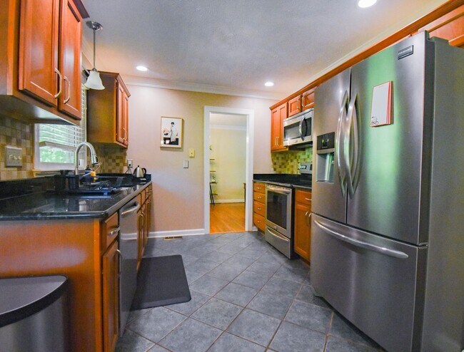 Building Photo - Coming Soon! 4 Bedroom 2.5 Bathroom With A Large Deck and 2 Car Garage! Near Methodist University