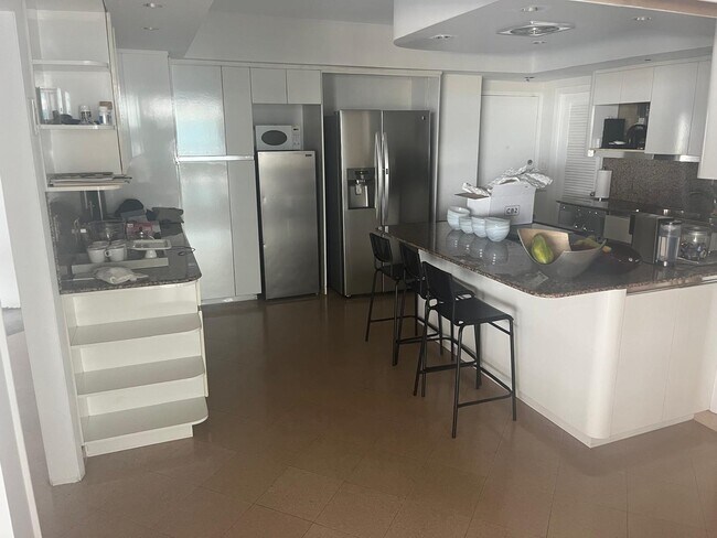 Building Photo - 10155 Collins Ave