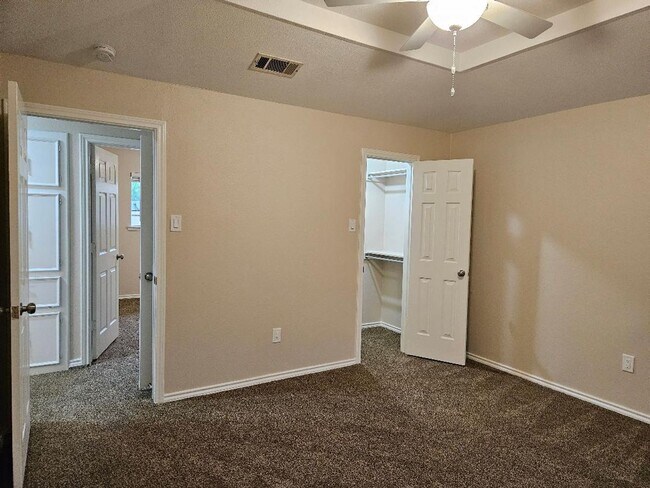 Building Photo - Three bedroom and two bathroom nicely remodeled with new flooring. Large wood fenced backyard