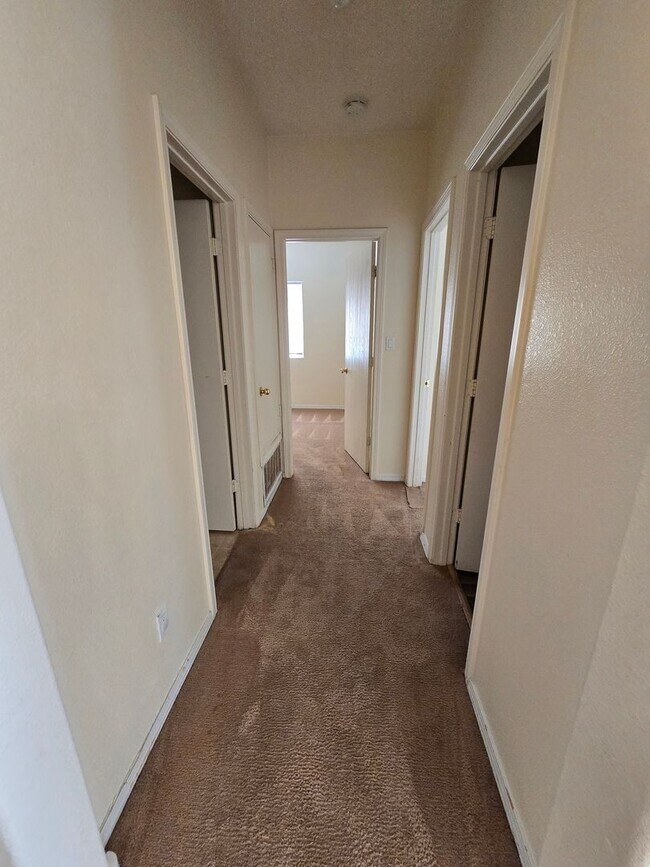 Building Photo - 4 bedroom 2 bath home with Refrigerated Air.