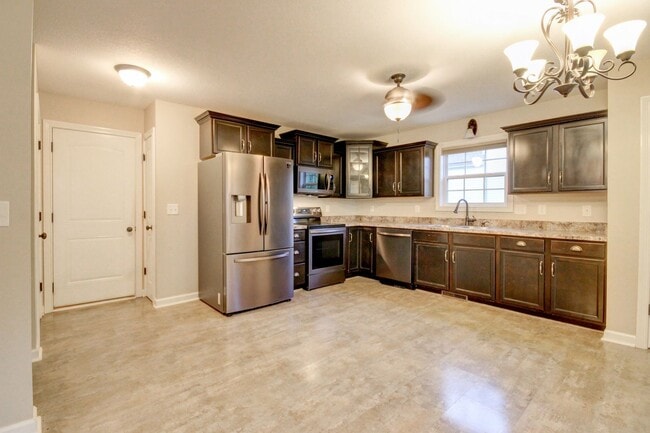 Building Photo - Stunning Brick Front Home With Fireplace A...