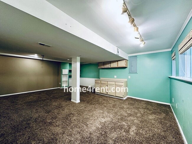 Building Photo - Blue Valley Schools w/ Wood Floors, Finished Basement and a Peaceful, Private Fenced Yard!