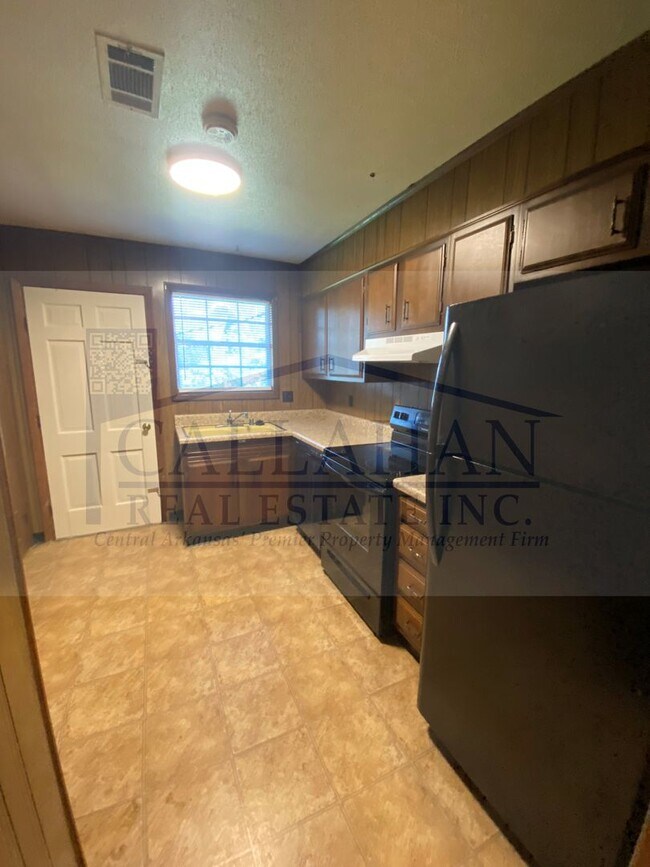 Building Photo - 8211 Woodview Dr N