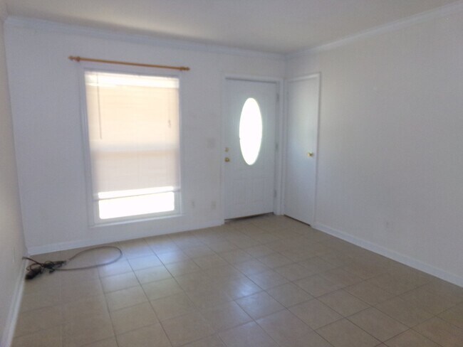 Building Photo - 2BR/1BA Milton Duplex with Huge Fenced Backyard, Tile Flooring Throughout & Convenient Access to ...