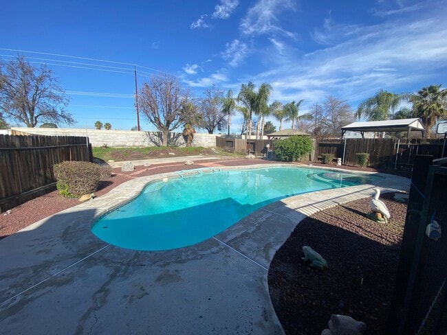 Building Photo - Get ready for Summer in this 3 BD 2 BA SW home with a Pool on a corner lot