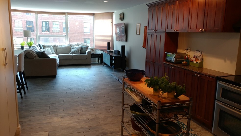 Kitchen opens up to living area that fits a full-sized couch and 4 top table - 720 W Gordon Terrace