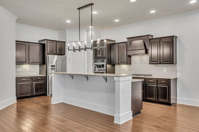 Building Photo - Beautifully maintained and move-in ready, this stunning mostly one-level all-brick home