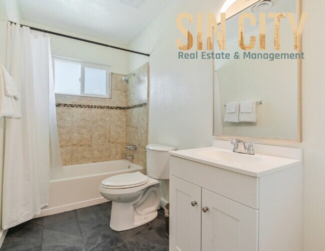Building Photo - "Charming 4-Bedroom Retreat in Las Vegas –...