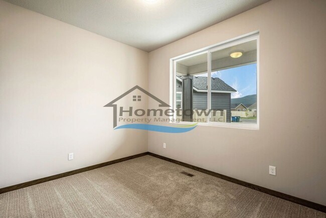 Building Photo - Woodbridge South Home with 4 Bedrooms and 3 Bathrooms in Post Falls build in 2021!