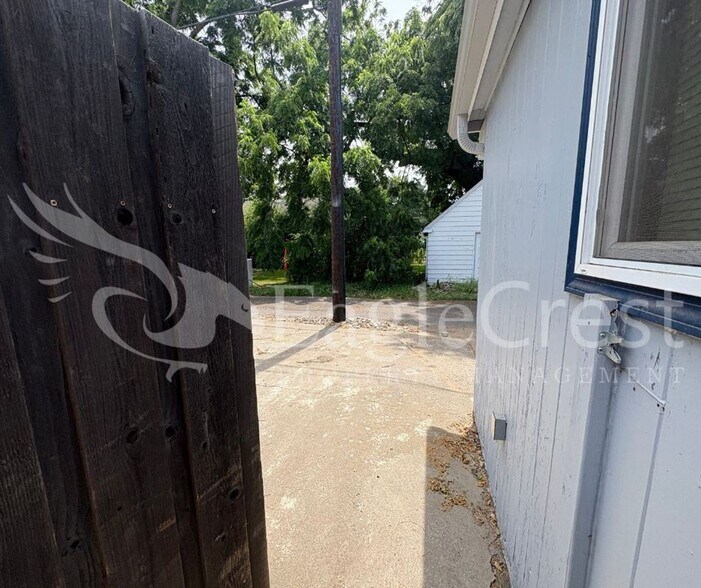 Building Photo - Three Bedroom, Two Bathroom House with Fenced Yard and Outdoor Fireplace