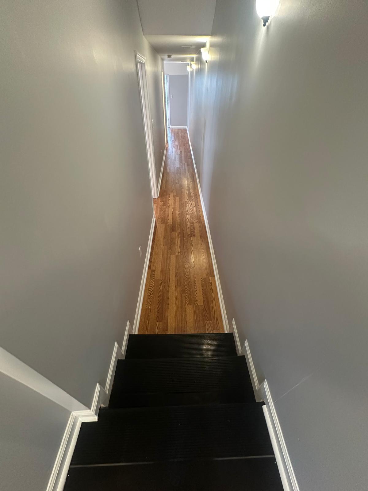 Steps and hallway leading to the bedrooms and bathrooms - 1426 Madison Ave