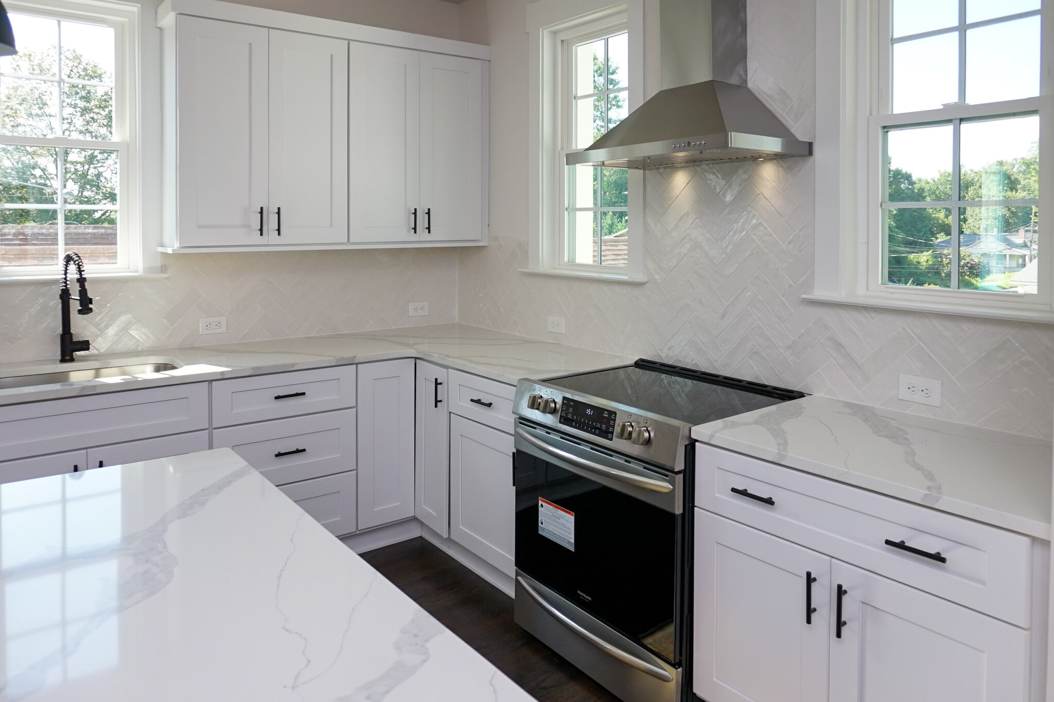 Granite countertops and custom cabinetry flow into the living room, dining room and optional office - 1003 Parkwood Ave