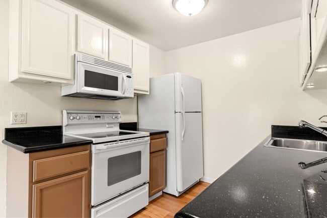 Building Photo - Modern Oakland Living: New Floors, Private Balcony, and Parking