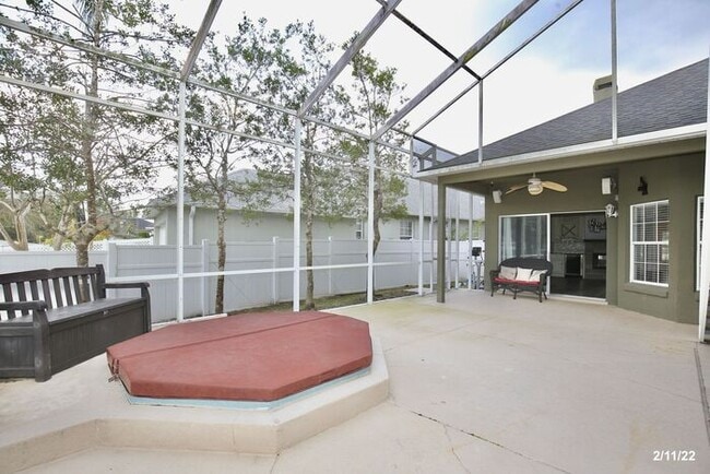 Building Photo - Luxurious 4/3 Waterfront Home with an In-ground Spa, an In-law Suite and a 2 Car Garage in the Hi...