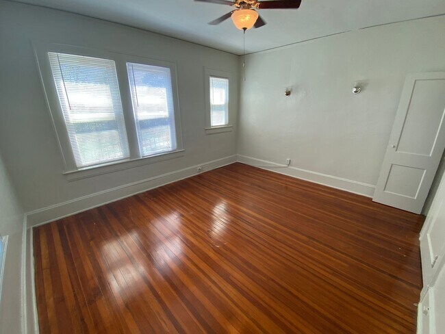 Building Photo - Huge Trinity Park Duplex with Office, Shared Fenced Yard and Adorable Porch!