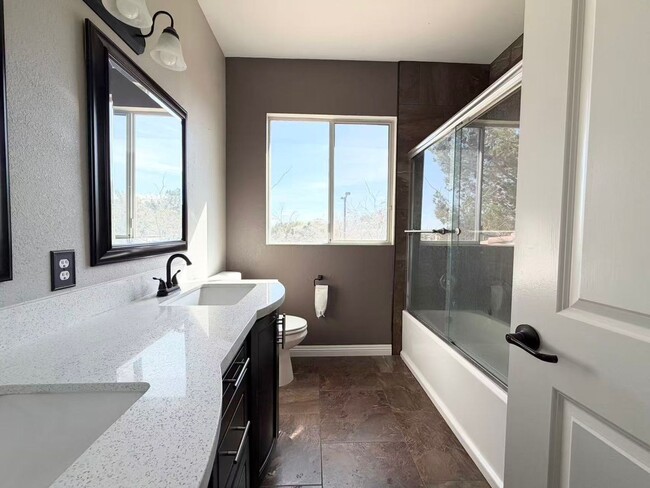 Building Photo - Wonderful corner lot home features 4 bedrooms and 3 full bathrooms