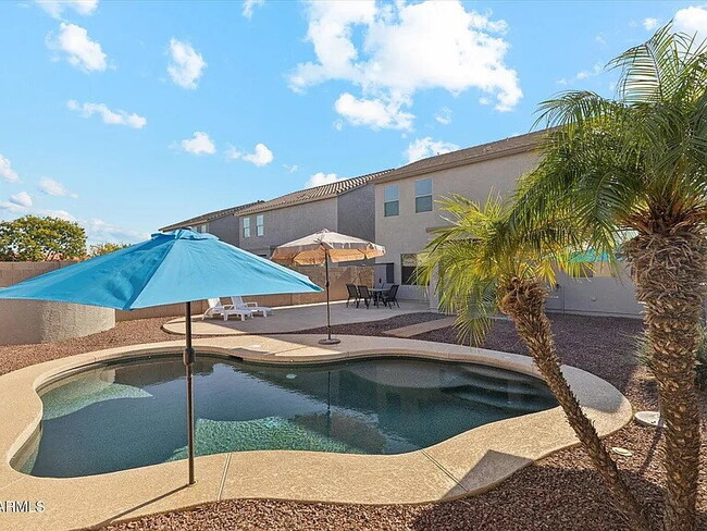 Building Photo - "Spacious 4-Bed Oasis with Pool on East Goldmine Court – 2,425 Sq Ft of Comfort!"