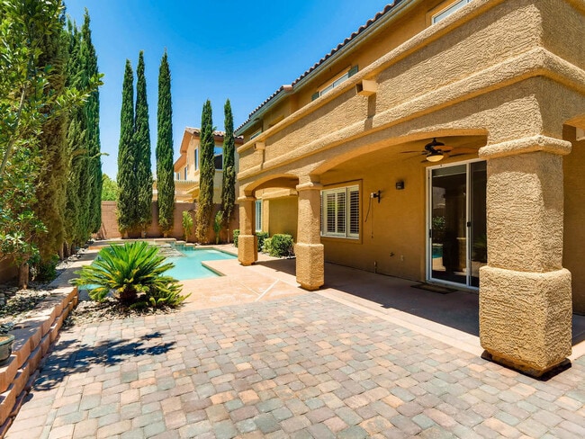 Building Photo - LUXURIOUS UPGRADED HOME IN A GATED SUMMERLIN AREA!!HOUSE HAS POOL AND SPA AND PATIO COVERED BACKY...