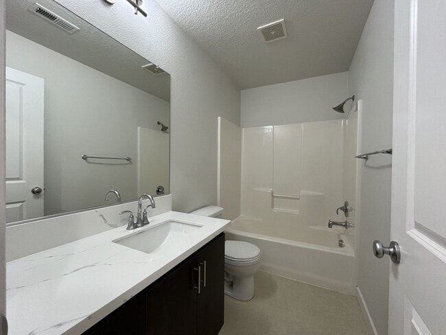 Building Photo - Beautifully Updated Bethany Townhome with Private Backyard and Modern Finishes