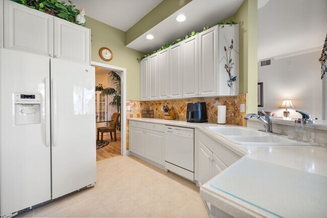 Building Photo - Experience Bell Tower Park. GATED ground floor 2 Bed 2 Bath Den 1 Car Garage Condo.