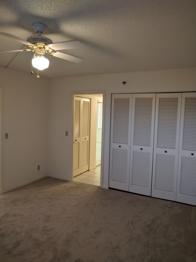 Front guest bedroom. New carpet. - 198 NW 67th St