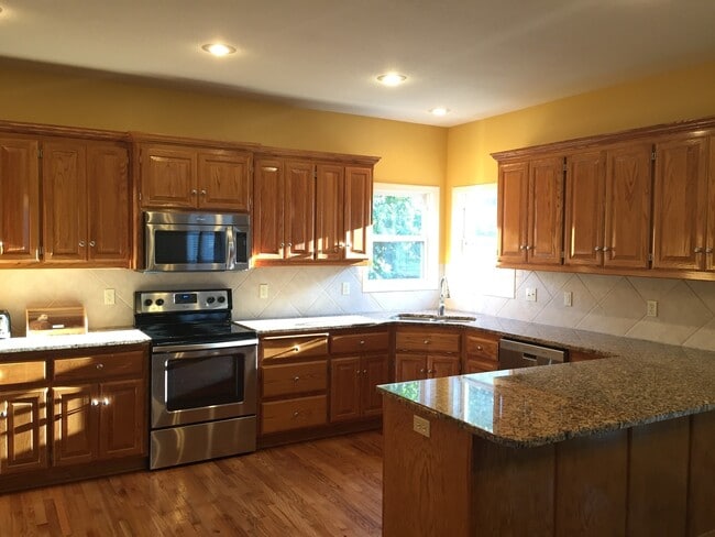 Building Photo - {7301} Quiet Cul-de-sac + Three Car Garage + Updated Kitchen + Finished Basement + Bedroom Level ...