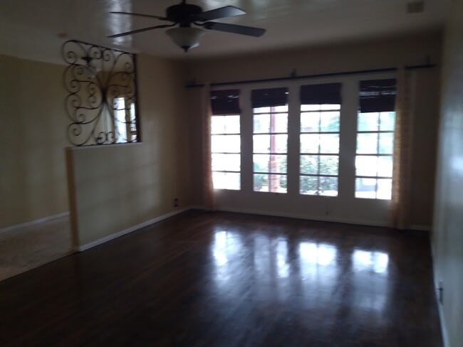 Living room with hardwood floors - 6601 Louise Ave