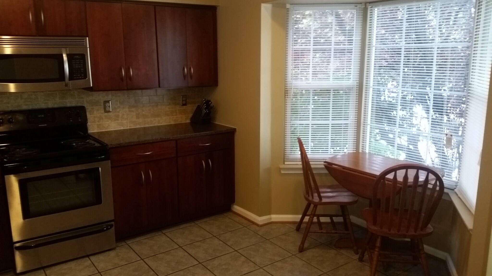Completely upgraded kitchen with custom-cabinets, stone countertop, and all stainless steel appliances - 2469 Wentworth Drive