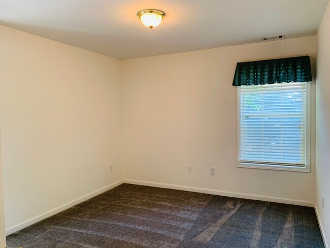 Building Photo - Great location! Lawncare/water is included...