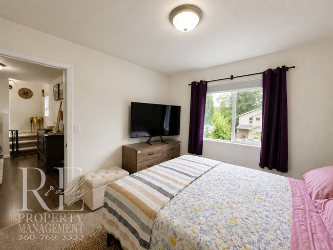 Building Photo - Spacious 3-Story Home with Flexible Living Space, Heat Pump & Private Deck Retreat