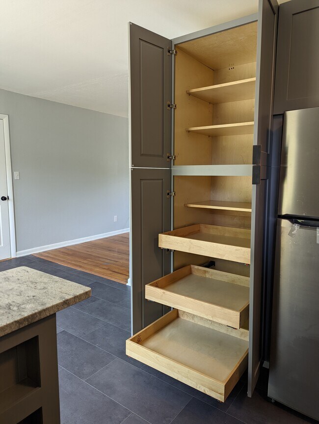 Floor to ceiling pantry with heavy duty pull-out drawers. Soft close. - 2008 E Huntsville Rd