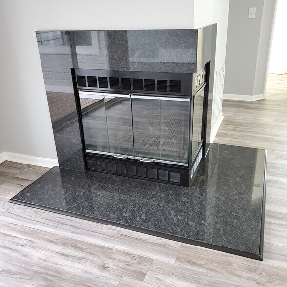 Granite fireplace matching kitchen - 20 Greystone Ct